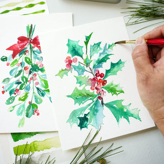 Painting holly berries and mistletoe in watercolor for Christmas cards