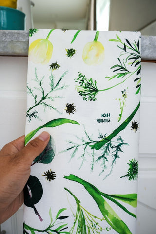 Green Botanical Tea Towel with Jean Choe's watercolor botanical artwork including tulips, eucalyptus, and other greenery