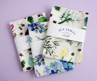 Green Botanical Tea Towel with Jean Choe's watercolor botanical artwork including tulips, eucalyptus, and other greenery