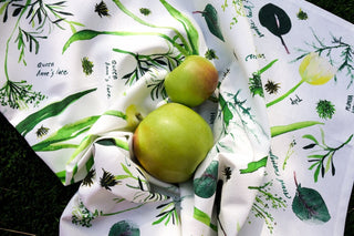 Green Botanical Tea Towel with Jean Choe's watercolor botanical artwork including tulips, eucalyptus, and other greenery