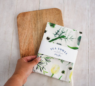 Green Botanical Tea Towel with Jean Choe's watercolor botanical artwork including tulips, eucalyptus, and other greenery