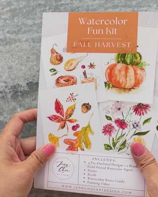 Video showing Jean Choe's watercolor fun kit for Fall Harvest of pumpkins, fall desserts and leaves, with pre-outlined pages, a paint dot card and a brush.