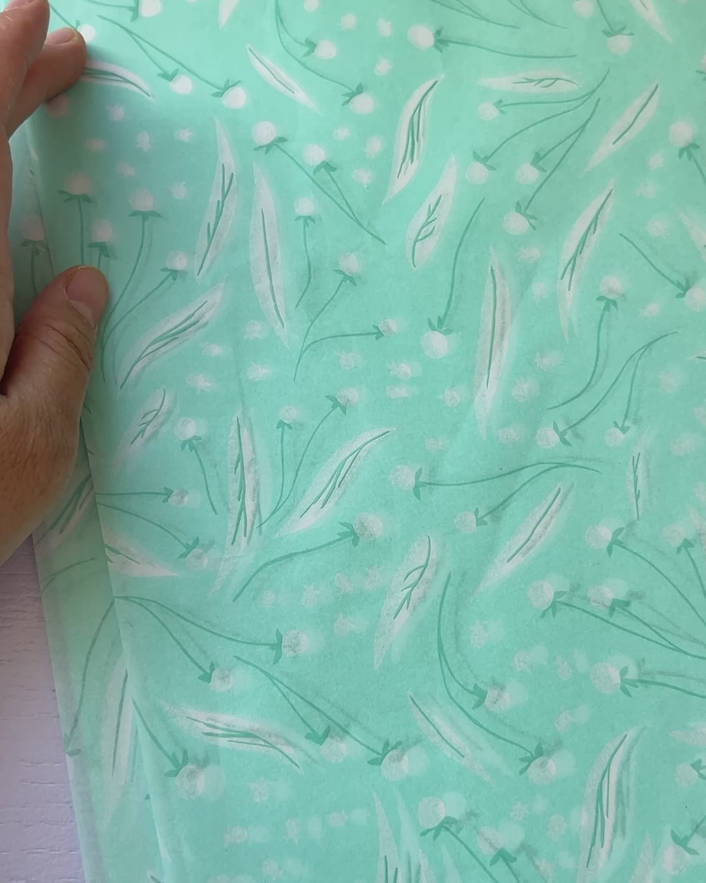 Video showing high quality tissue paper with Jean Choe's botanical design
