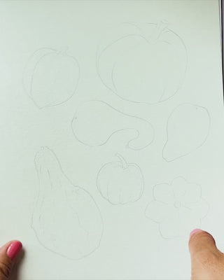 Video showing Jean Choe's watercolor pages with pre-outlined designs of Fall Harvest