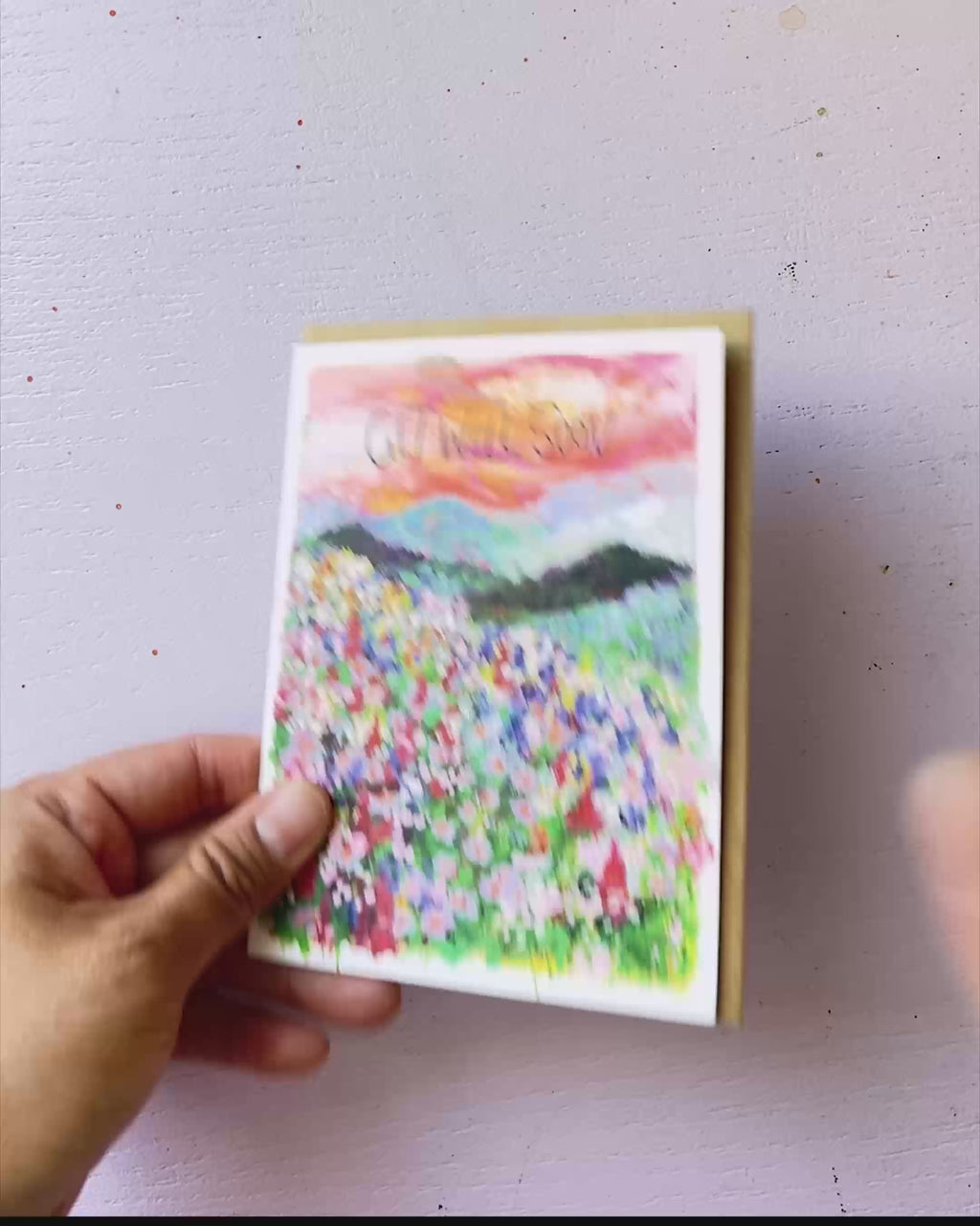 Video showing Jean Choe's greeting card of Get well wishes with  spring wildflower field