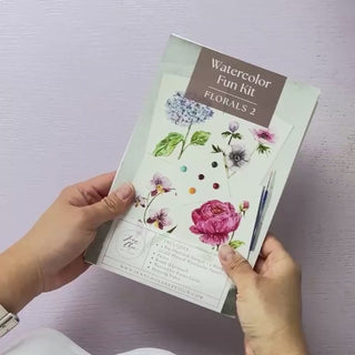 Video showing Jean Choe's watercolor fun kit for florals, with pre-outlined pages, a paint dot card and a brush.