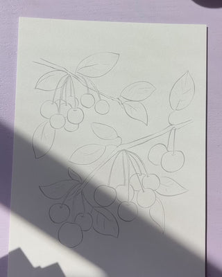 Video showing Jean Choe's watercolor pages with pre-outlined designs of  fruits