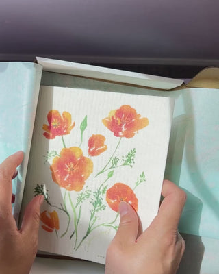 Video showing Jean Choe's Kitchen gift set of tea towel, Swedish dishcloth and apron