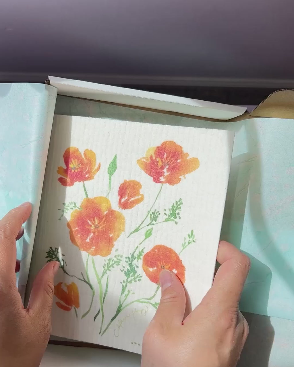 Video showing Jean Choe's Kitchen gift set of tea towel, Swedish dishcloth and apron