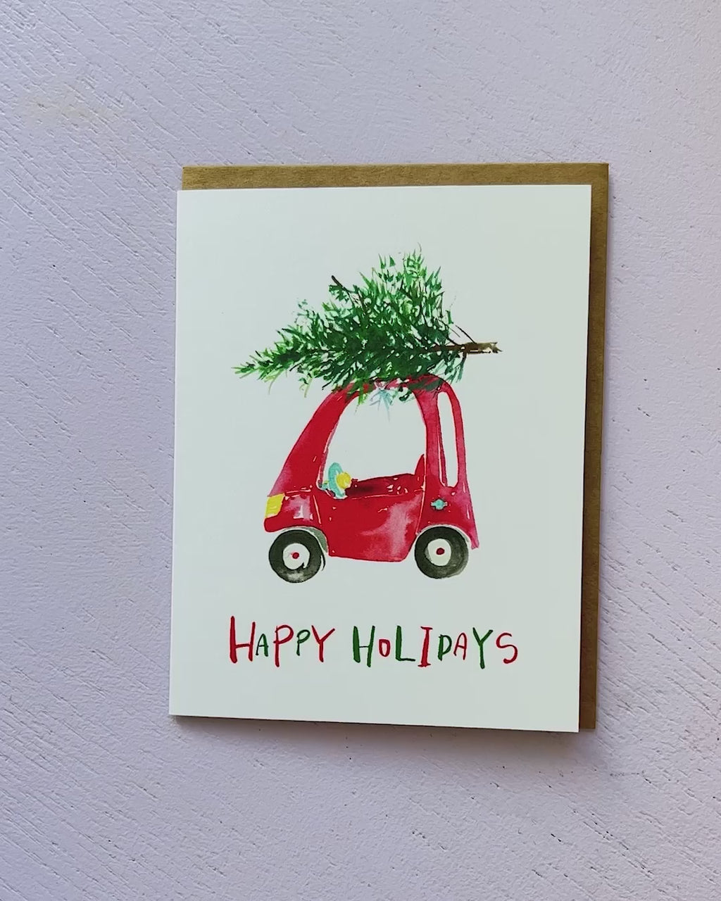 Video showing Jean Choe's greeting card of Toy Car carrying a winter Christmas tree